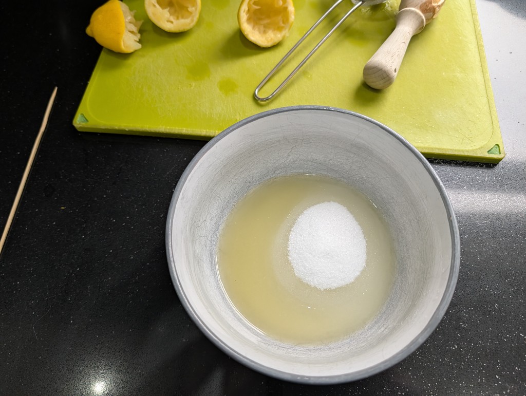 Lemon juice and caster sugar ready to mix